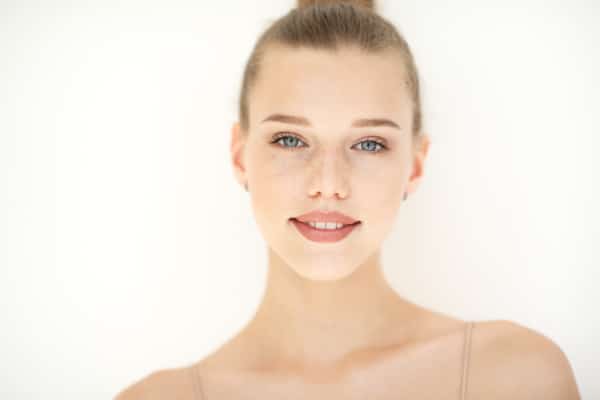 Portrait of beautiful white woman with clean skin