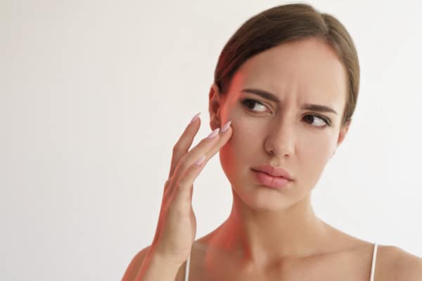 Portrait of a woman unhappy with her skin health