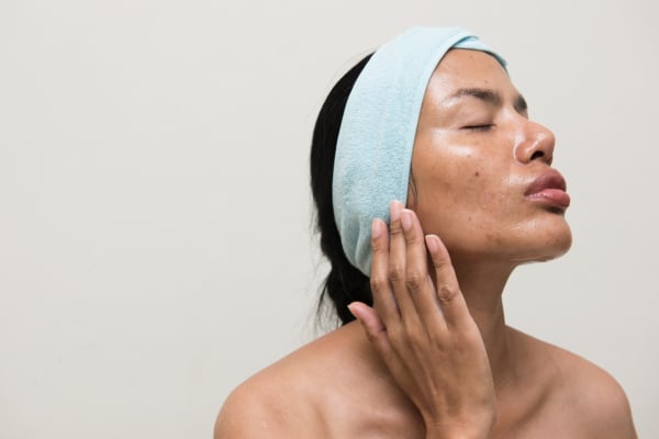 Sideview portrait of a woman with very oily skin